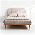 Upholstered bed frame with wooden legs and mattress support in beige color
